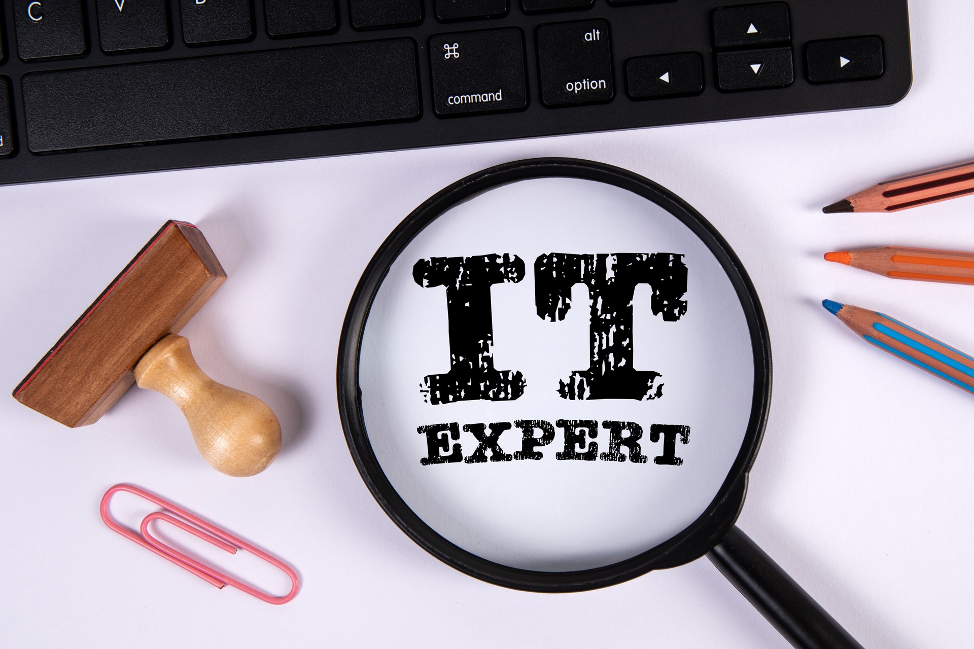 IT EXPERT Concept. Computer keyboard on a white office table